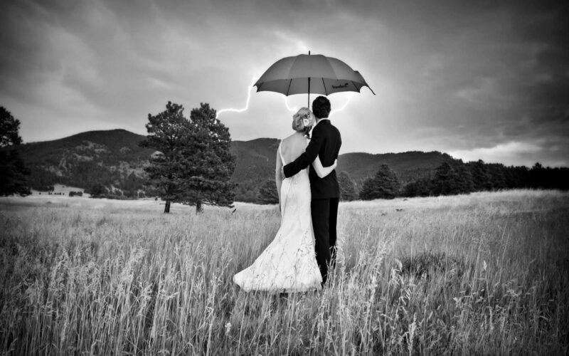 Avatarbild eines schwarzen Paares mit einem Regenschirm